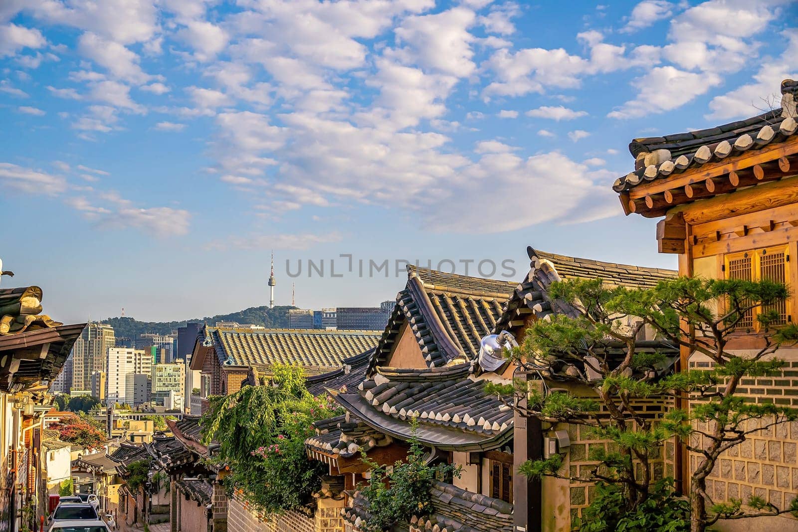 Bukchon Hanok Village with Seoul city skyline, cityscape of South Korea at sunset