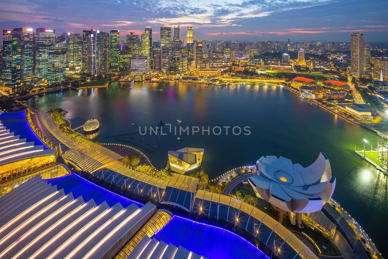 Downtown city skyline at the marina bay, cityscape of Singapore  from top view at sunset