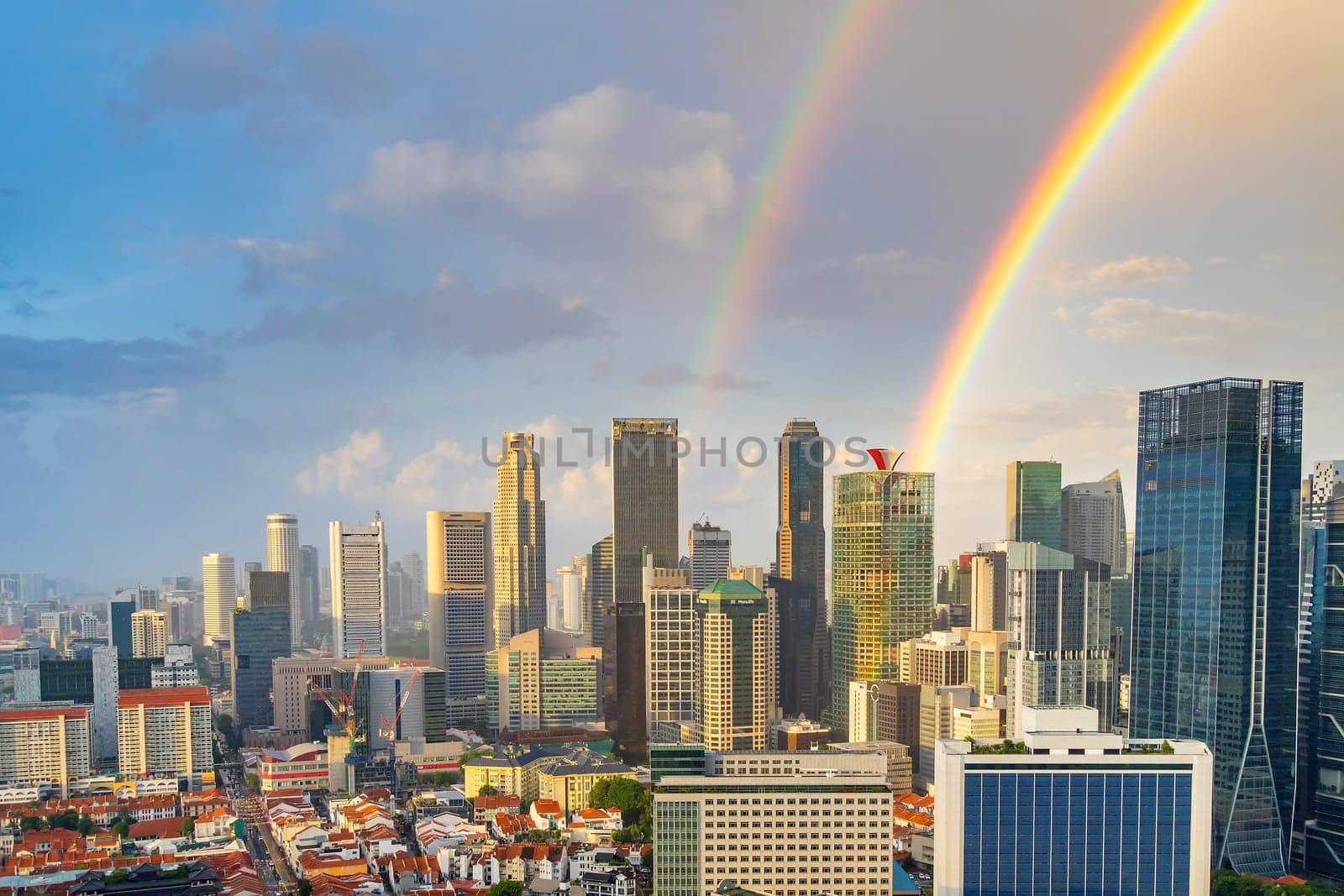 Downtown city skyline, cityscape of Singapore with rainbow