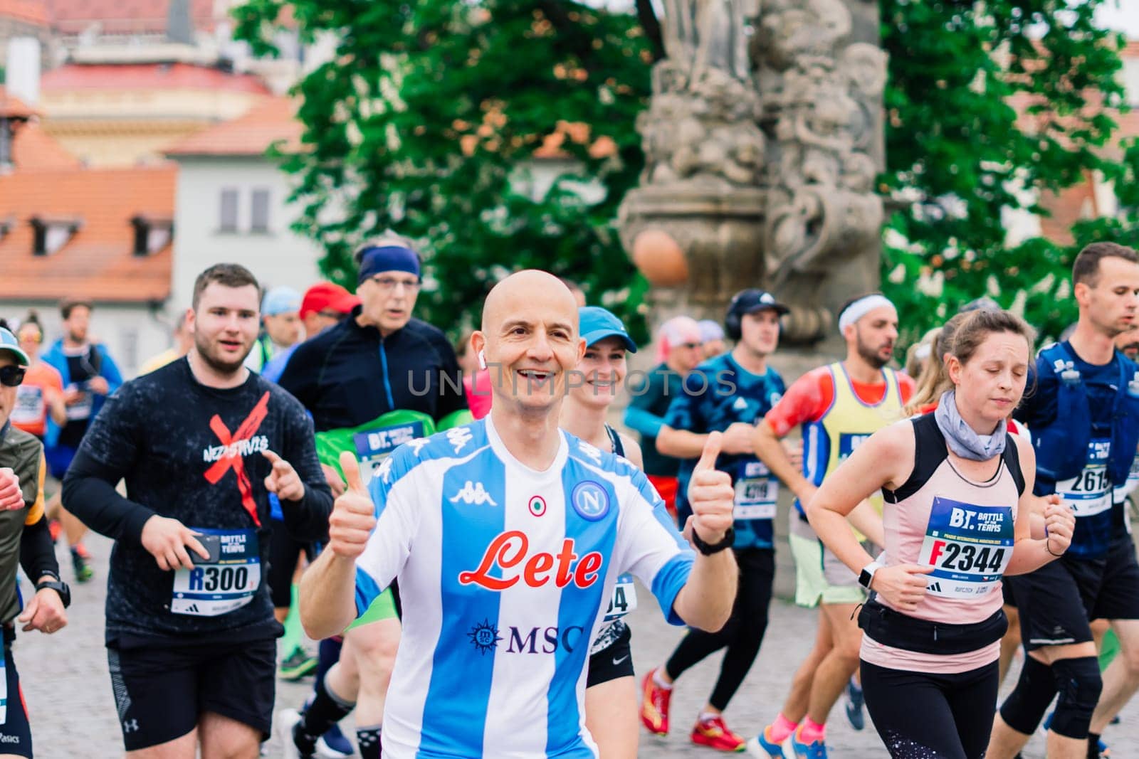 Prague, Czechia - 7th May 2023 - Group athletes runners run marathon in a sunlight