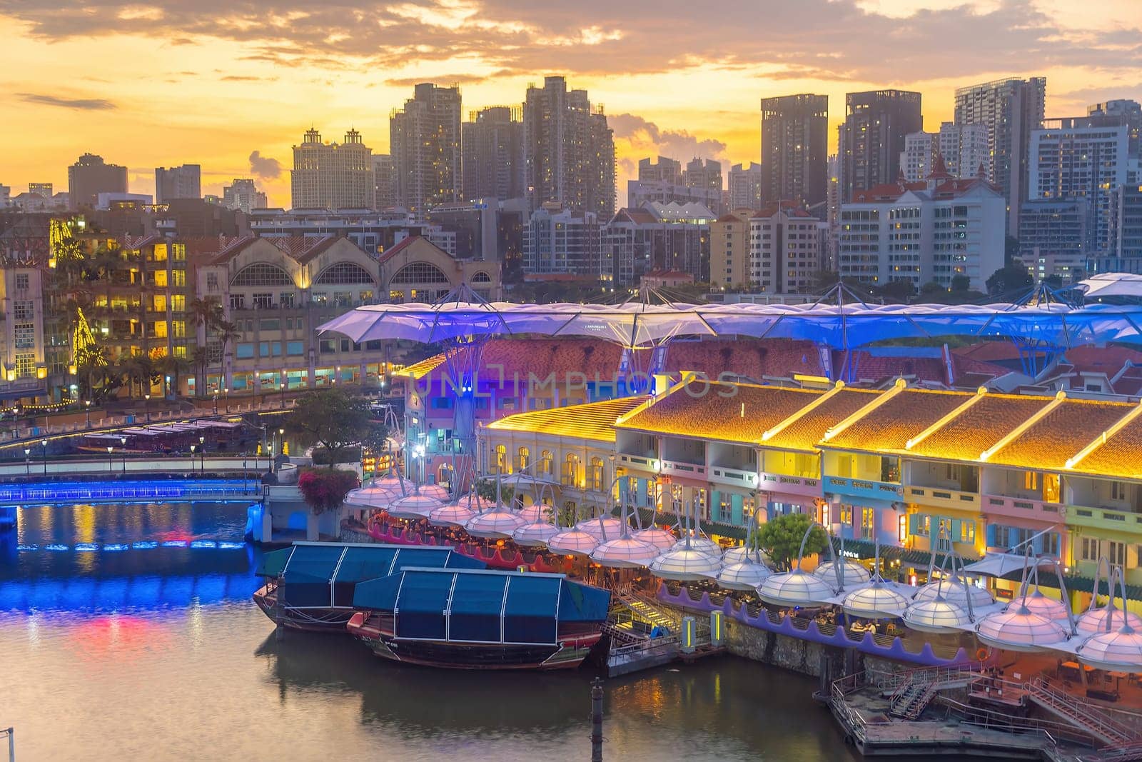 Aerial view cityscape of Clarke Quay, Singapore city skyline at sunset