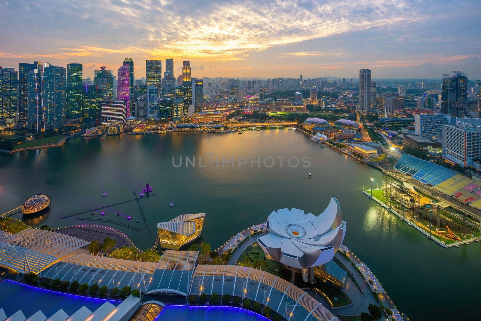 Downtown city skyline at the marina bay, cityscape of Singapore  from top view at sunset