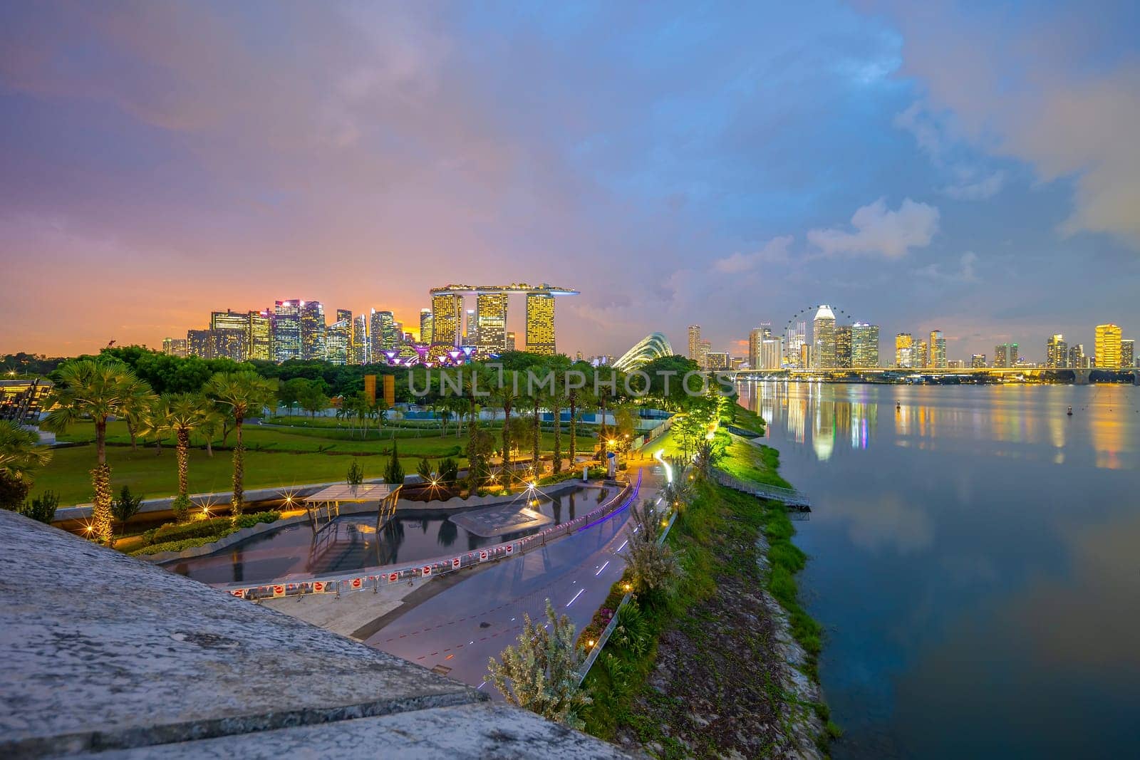 Downtown city skyline at the marina bay, cityscape of Singapore at sunset from Marina Barrage