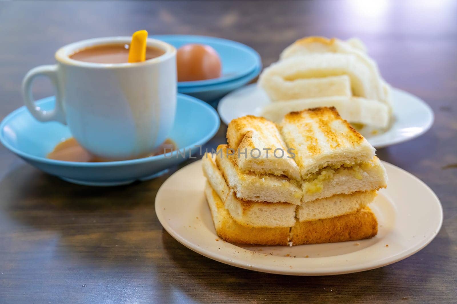 Traditional breakfast set and coffee, boiled eggs and toast, popular in Singapore by f11photo