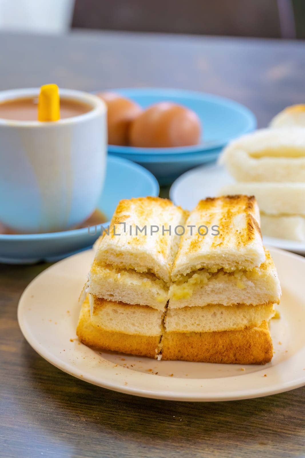 Traditional breakfast set and coffee, boiled eggs and toast, popular in Singapore by f11photo