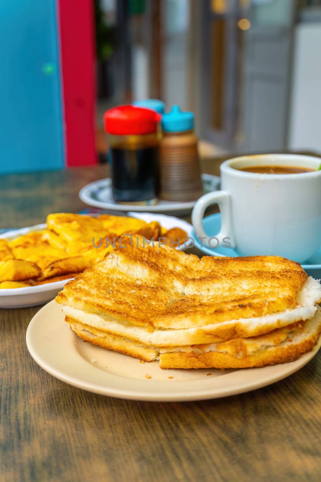 Traditional breakfast set and coffee, boiled eggs and toast, popular in Singapore by f11photo