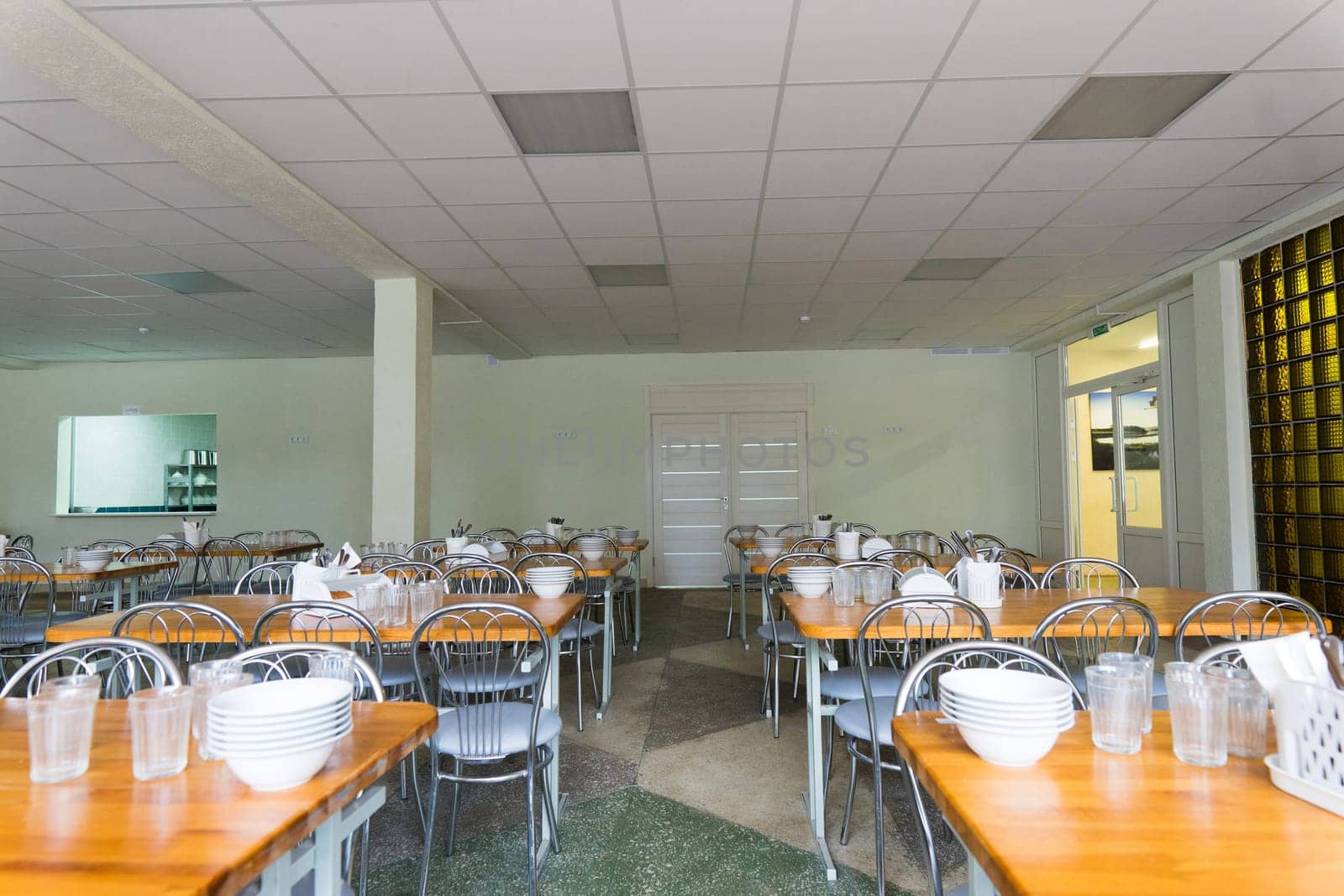 Chairs and tables. The dining hall in school is quarantined, isolation. by Zelenin