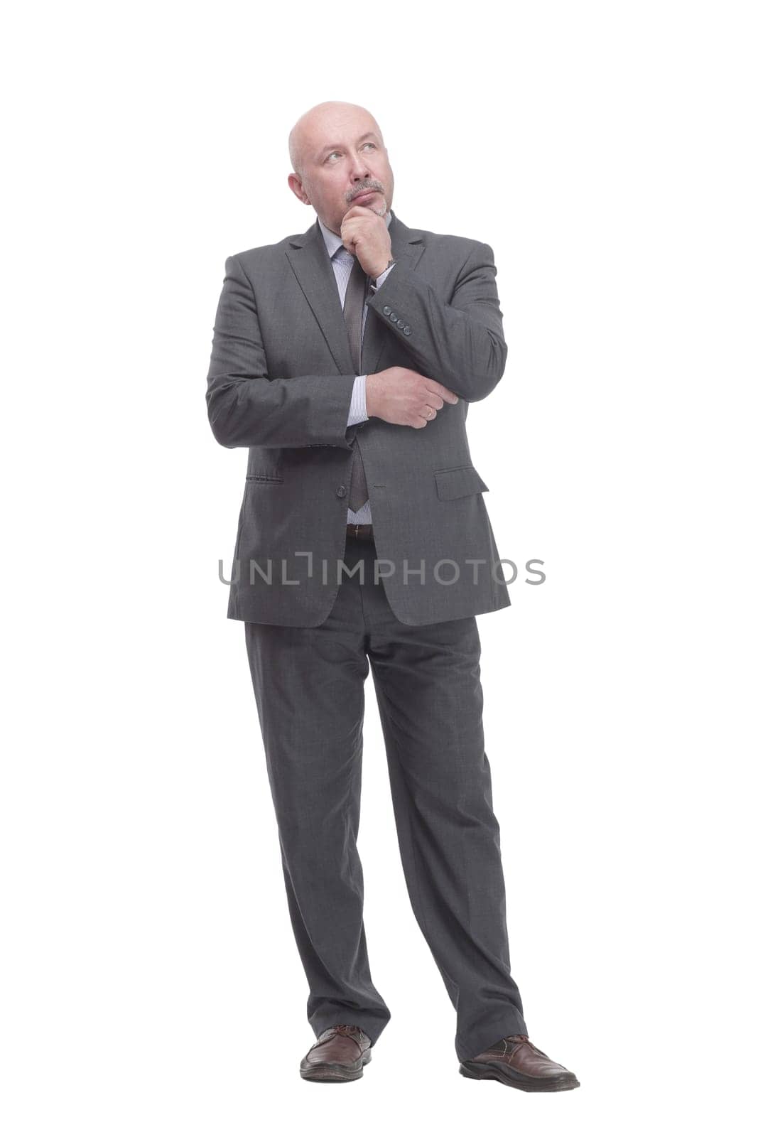 in full growth. thoughtful business man .isolated on a white background.