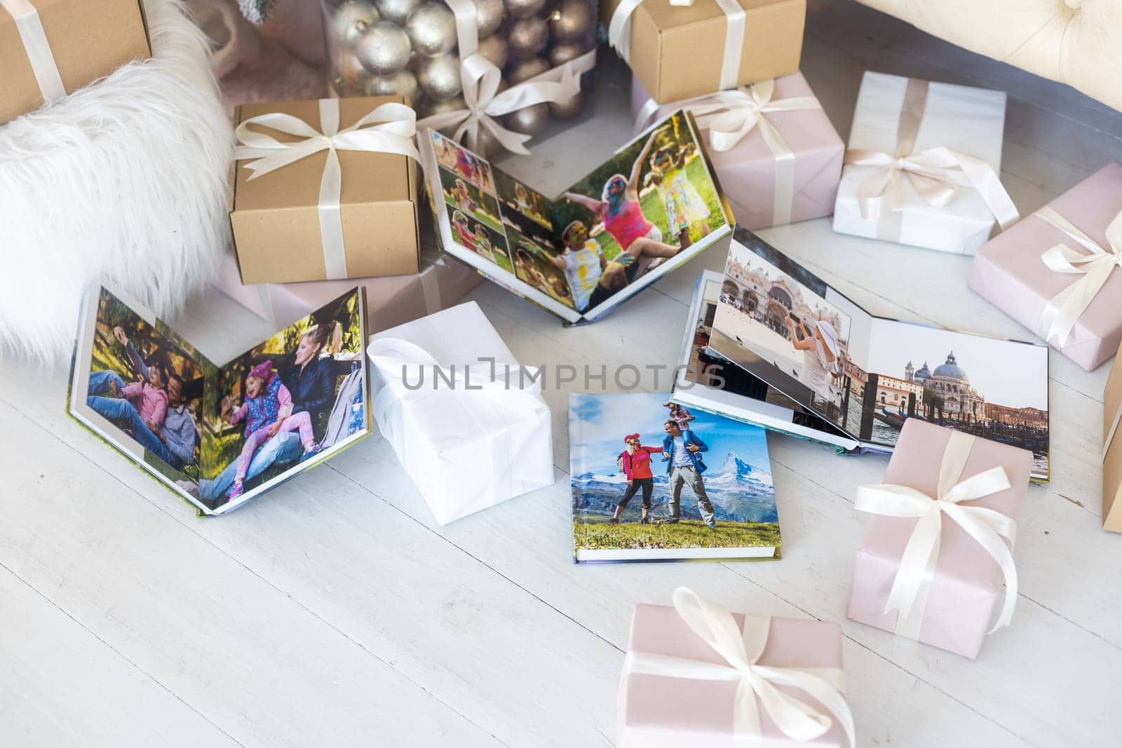 a Photobook of family.Photobook is gift. photo album next to gifts.