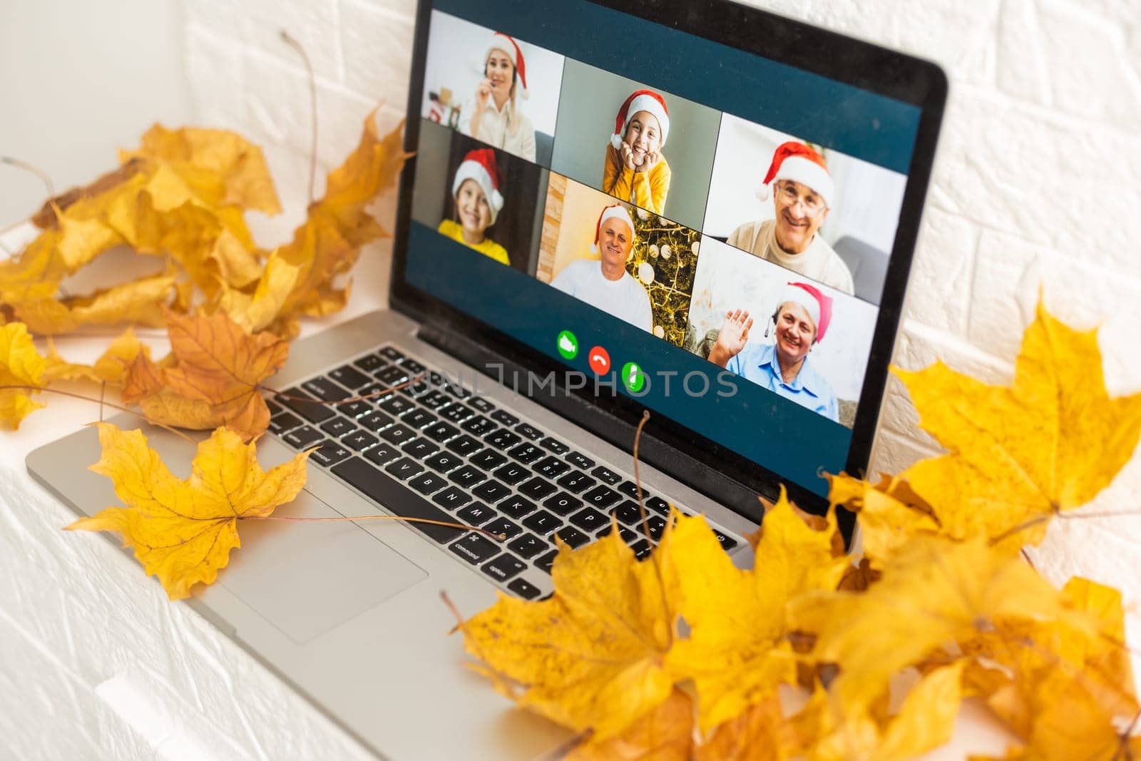 dry autumn leaves and laptop video chat by Andelov13