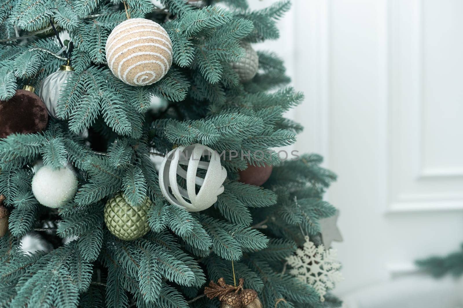 new year cozy home interior with christmas tree and garlands.