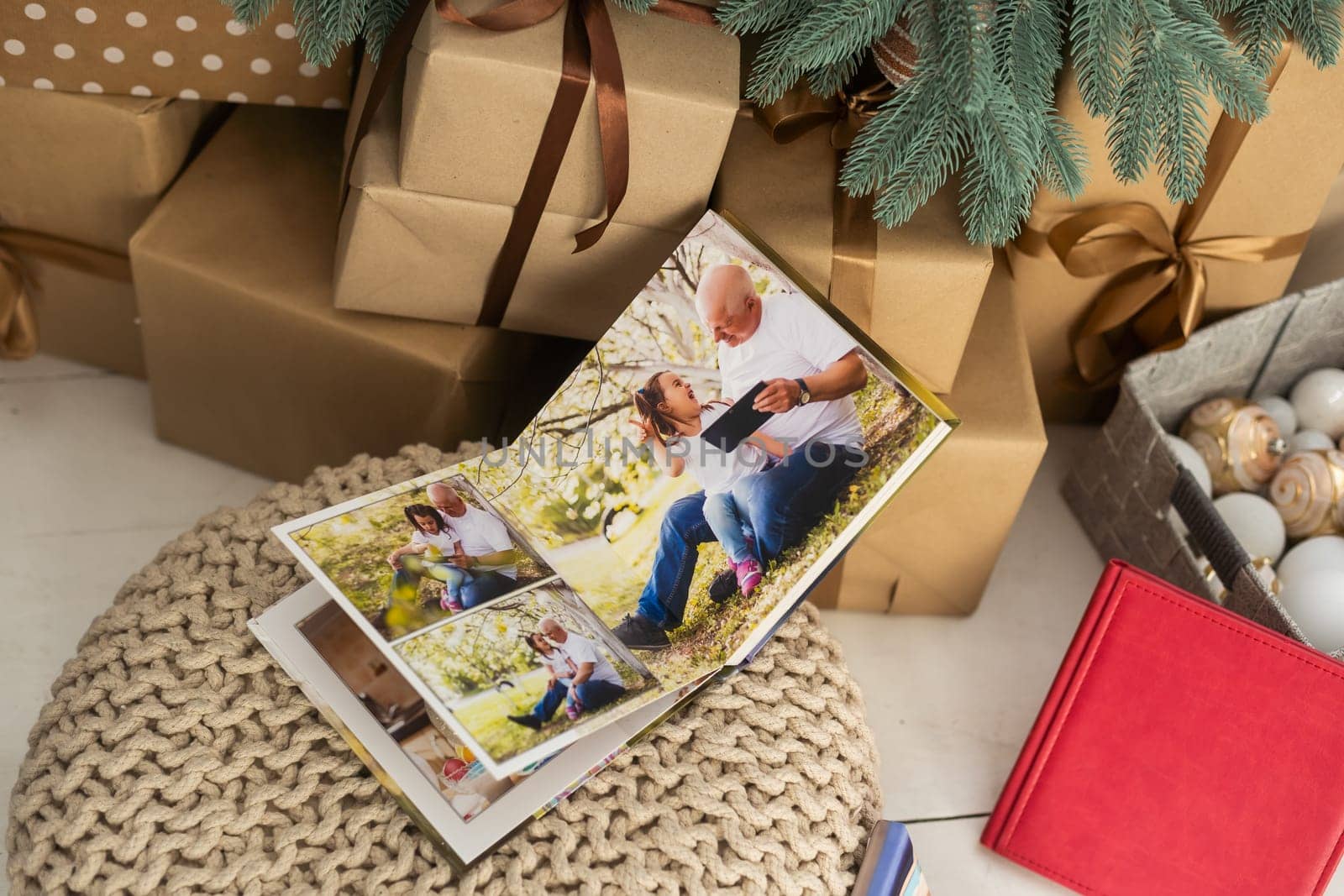 a photo album near the Christmas tree as a gift