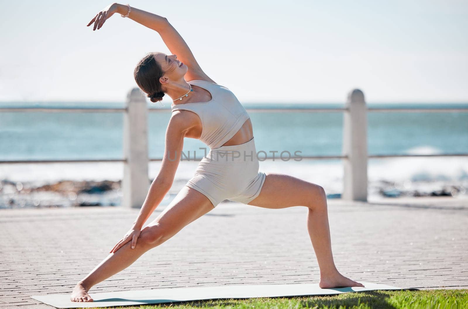 Stretching, yoga and woman in nature for fitness, meditation and body workout in New Zealand. Wellness, peace and girl with freedom and warm up to start an exercise and balance training in a park by YuriArcurs