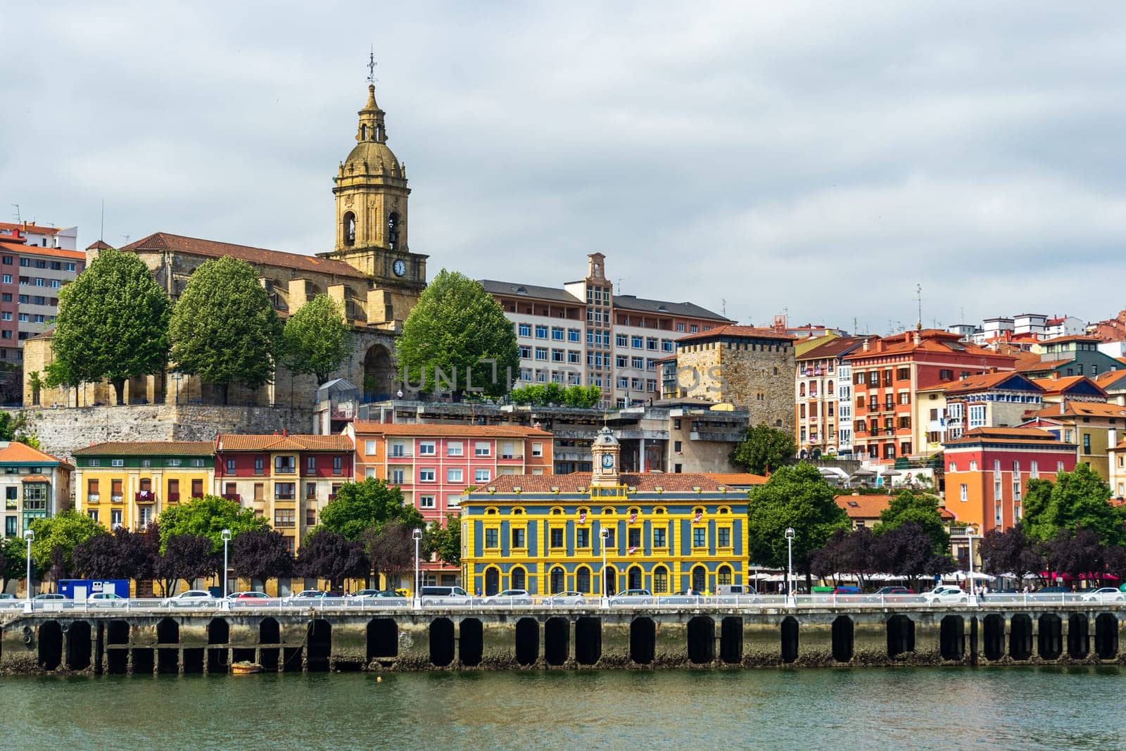 View of Portugalete town by Nervion river, and Sandra Maria basilica, Basque Country, Spain