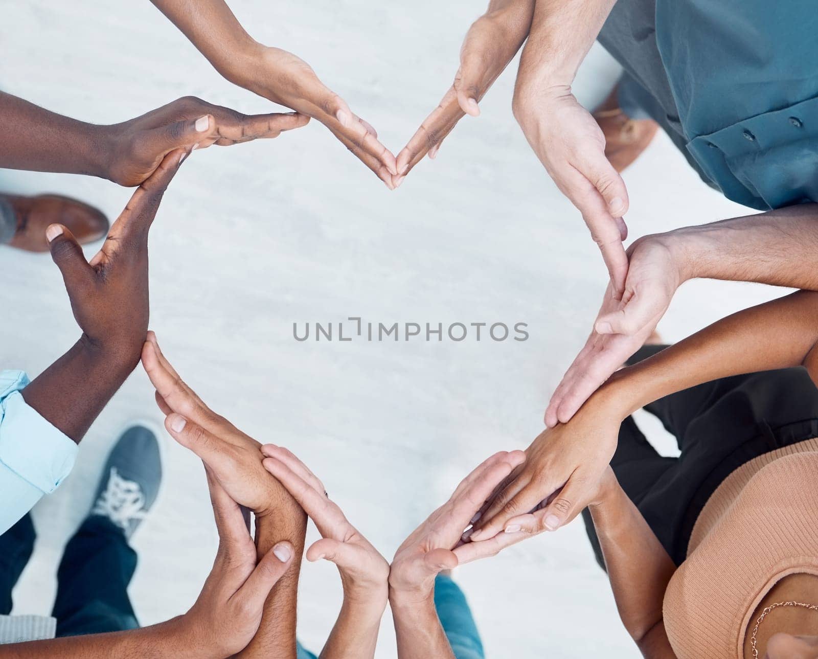 Teamwork hands, heart and diversity partnership, business people support or community care, motivation and trust. Above group team building for charity, kindness and global solidarity, love and hope.