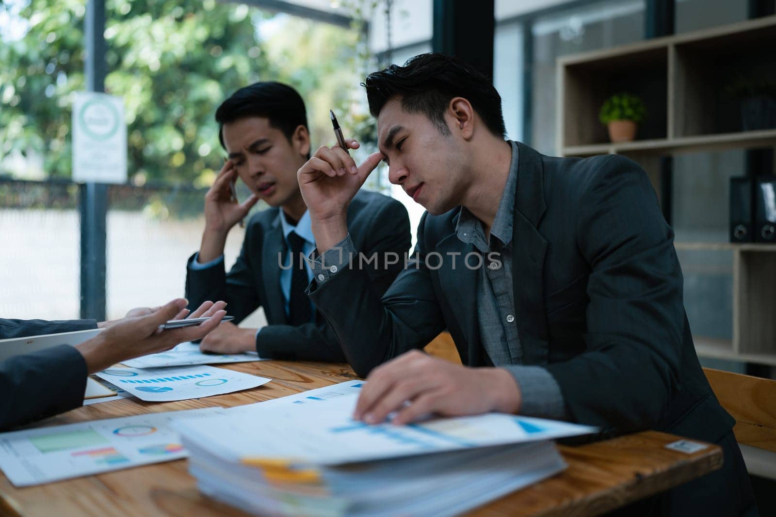 Burnout, stress and business man overworked from too much, work overload and pressure marketing corporate company. Time management, frustrated and tired employee. by Manastrong