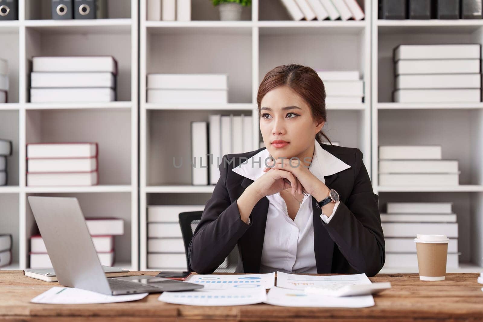 Employee feeling tired stressed with her work in the office, sad working woman overworked overtime, business woman upset with financial document by itchaznong