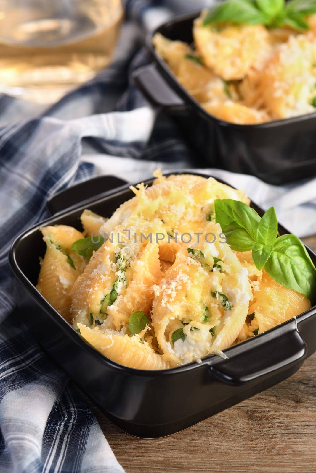 Pasta conchiglioni stuffed with spinach, ricotta and parmesan baked