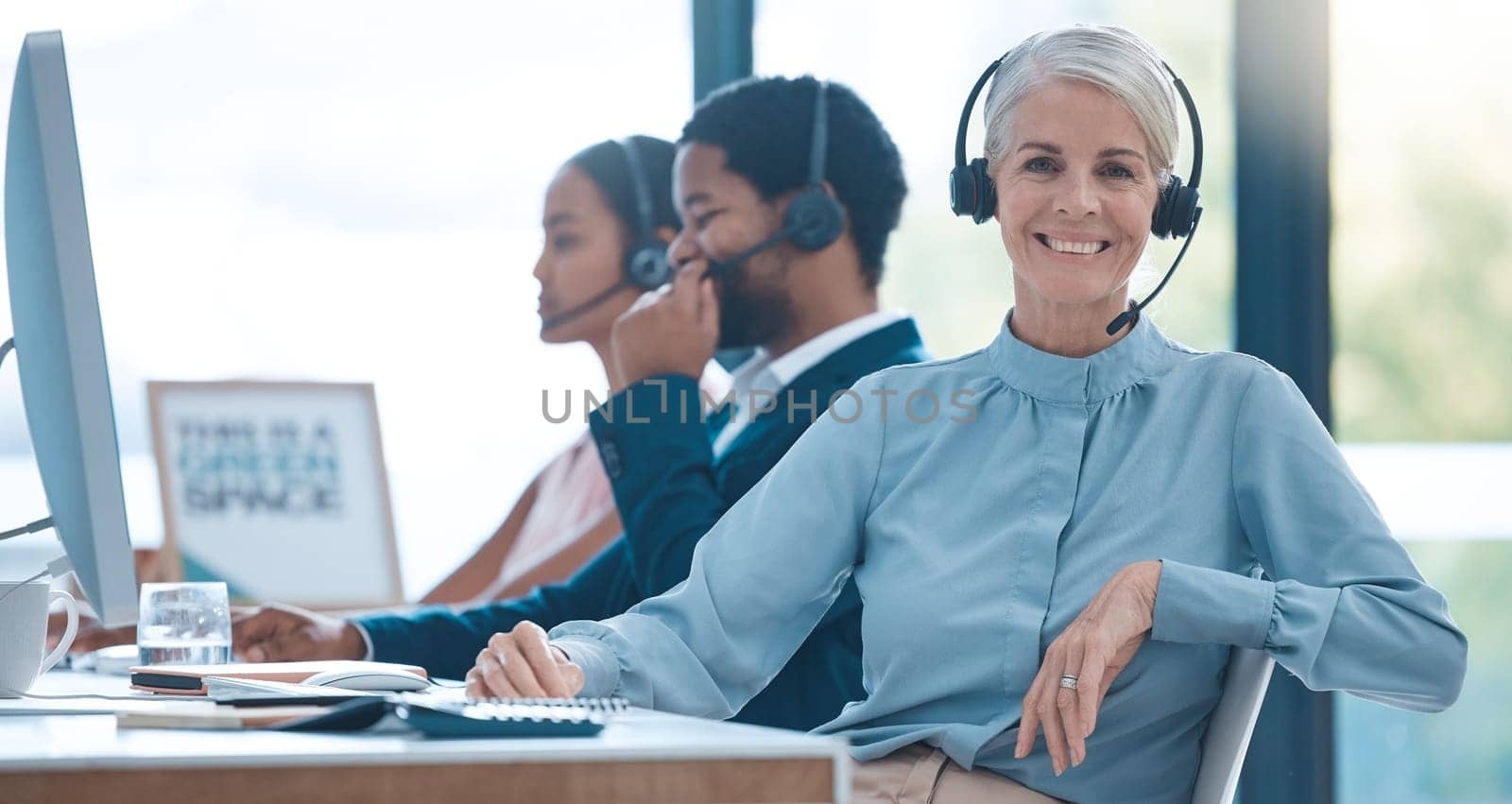 Worker, call center and contact, woman and headphones at desk, customer support or sales for telemarketing company. Senior, agent or consultant, office and working, communication and customer service.