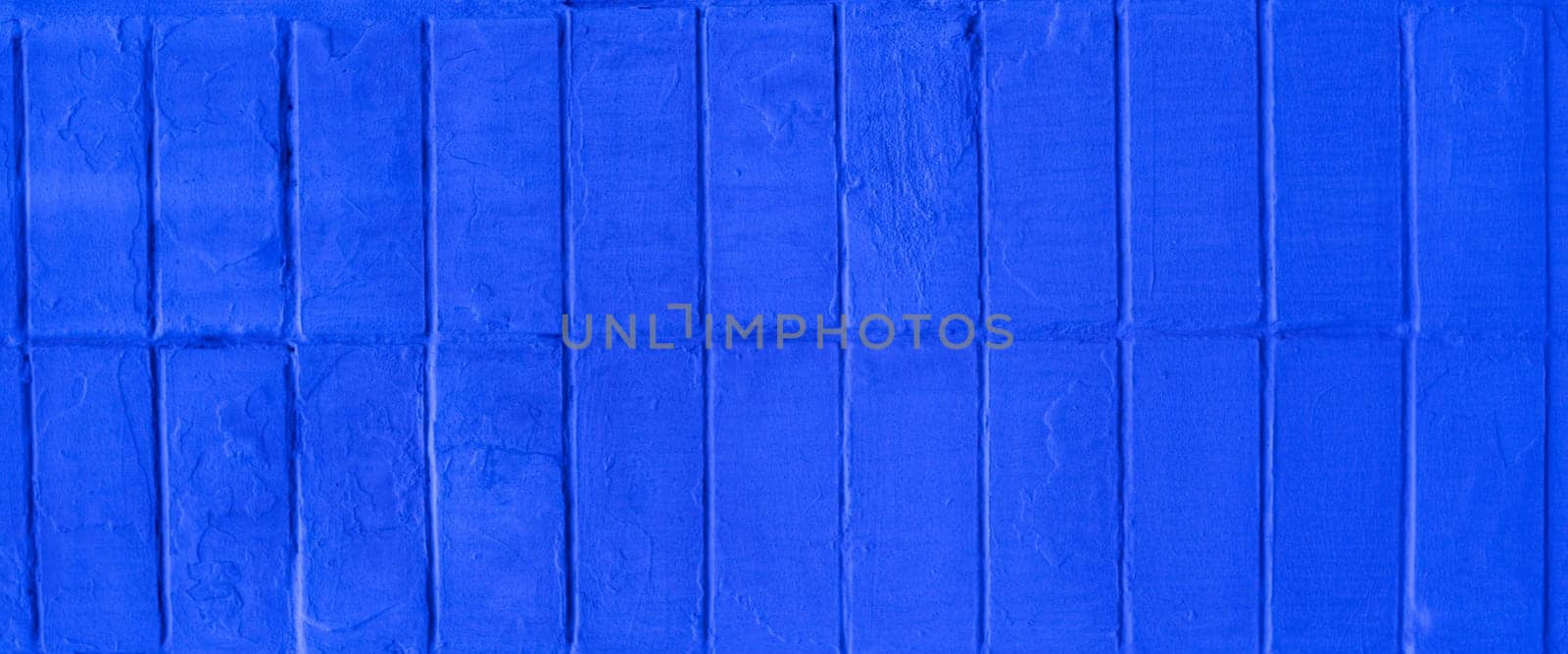 of a brick wall painted with blue paint. by gelog67