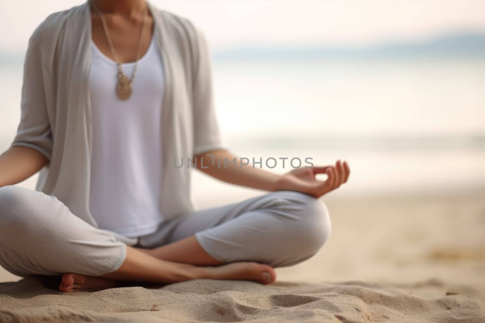 Unrecognizable woman sitting in lotus pose on the beach meditating, focus on foreground, selective focus, copy space. Generative AI