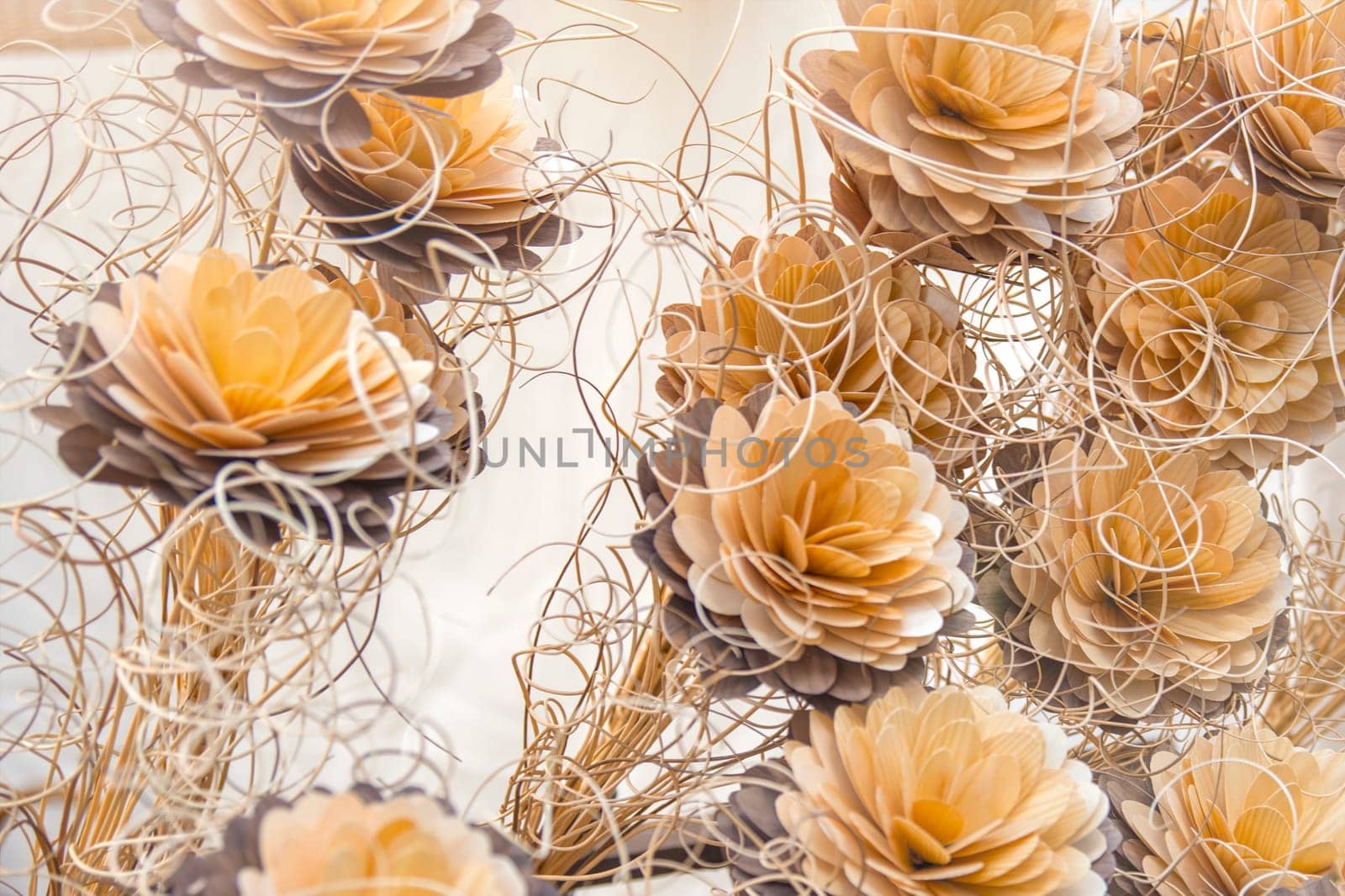 Decorative flowers are made of wood. Flowers small business concept. Mini factory of wooden flowers. High quality photo