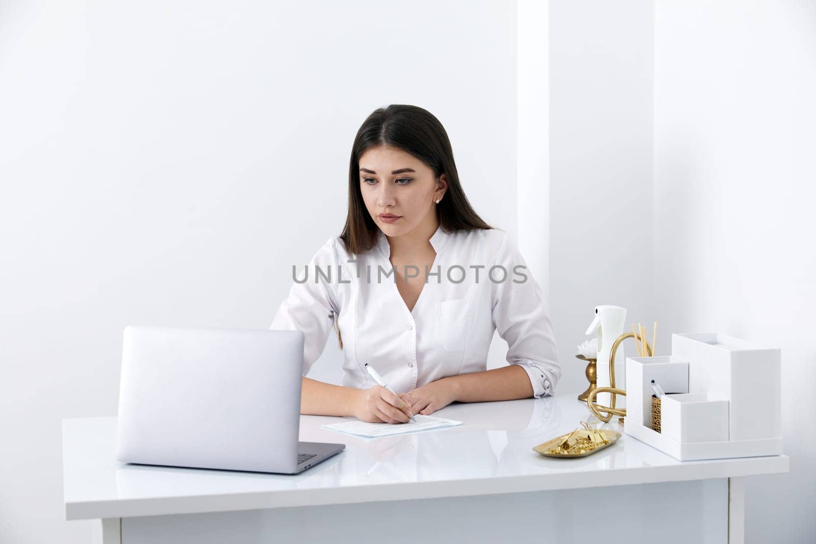 Female doctor make online video call consulting patient on laptop. Medical assistant young woman therapist videoconferencing to web camera. Telemedicine concept. Online doctor appointment. by Mariakray
