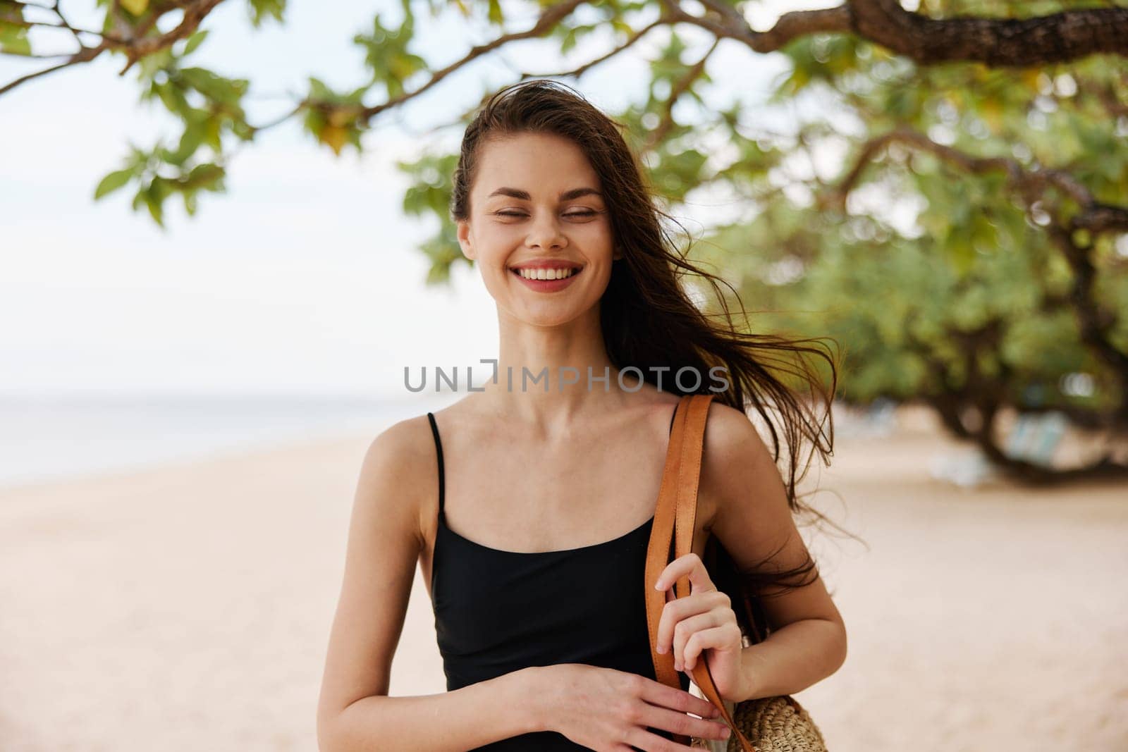 beach woman coast ocean happy smile relax vacation hair sea walk young long sunlight happiness beautiful running dress nature summer sand free