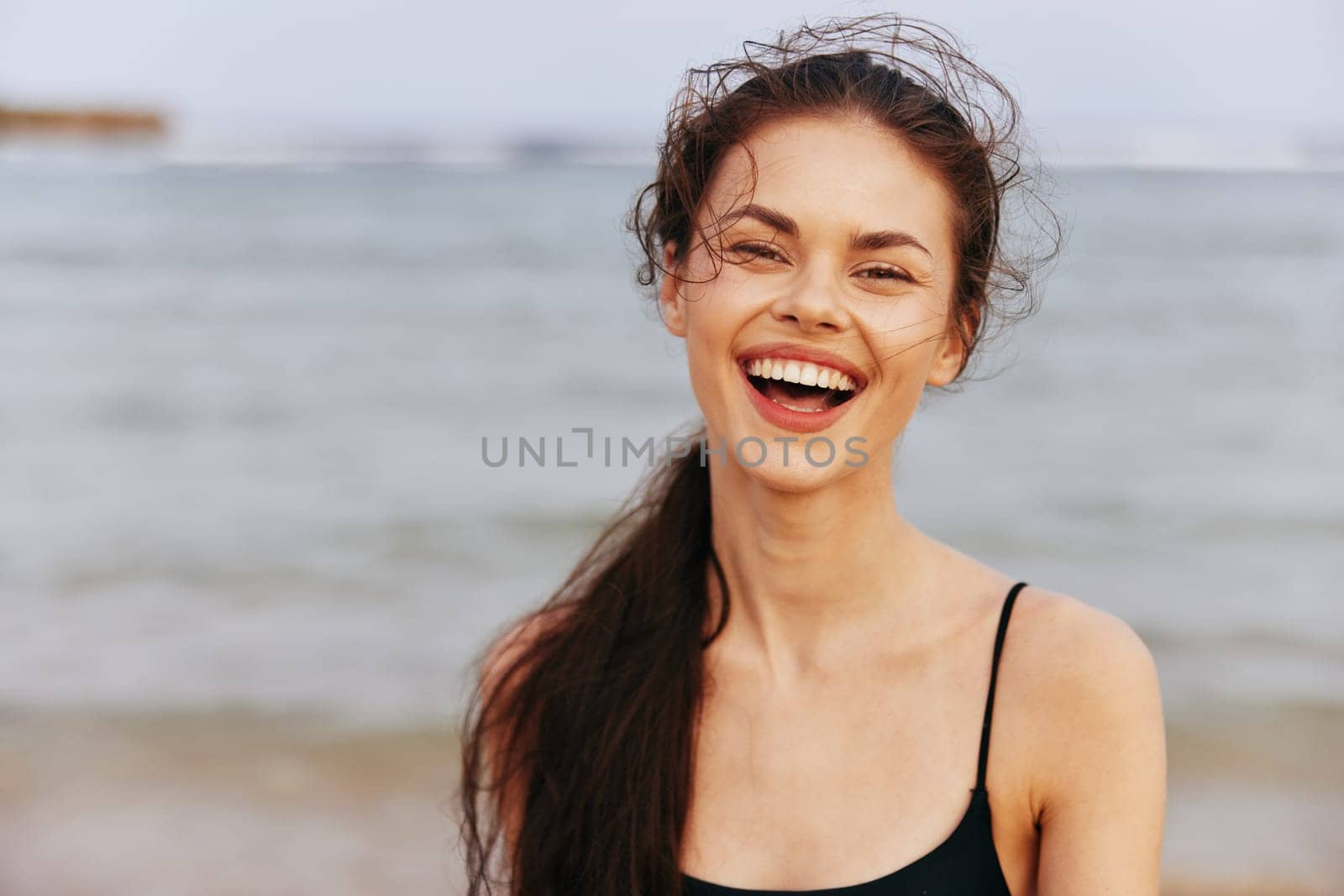 sunset woman smile beauty adult young peaceful freedom happy copy coast ocean female sand summer lifestyle beach holiday sea space smiling vacation