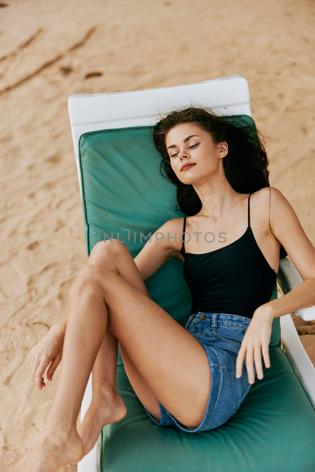 ocean woman young lying sunbed resort lifestyle beach smiling sea sand by SHOTPRIME