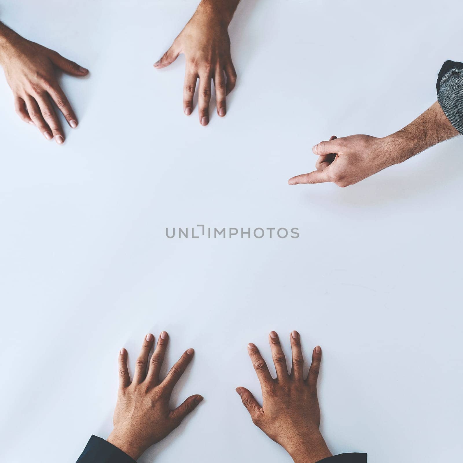 Get the team together and innovate. Studio shot of a group of unrecognisable people having a meeting against a white background