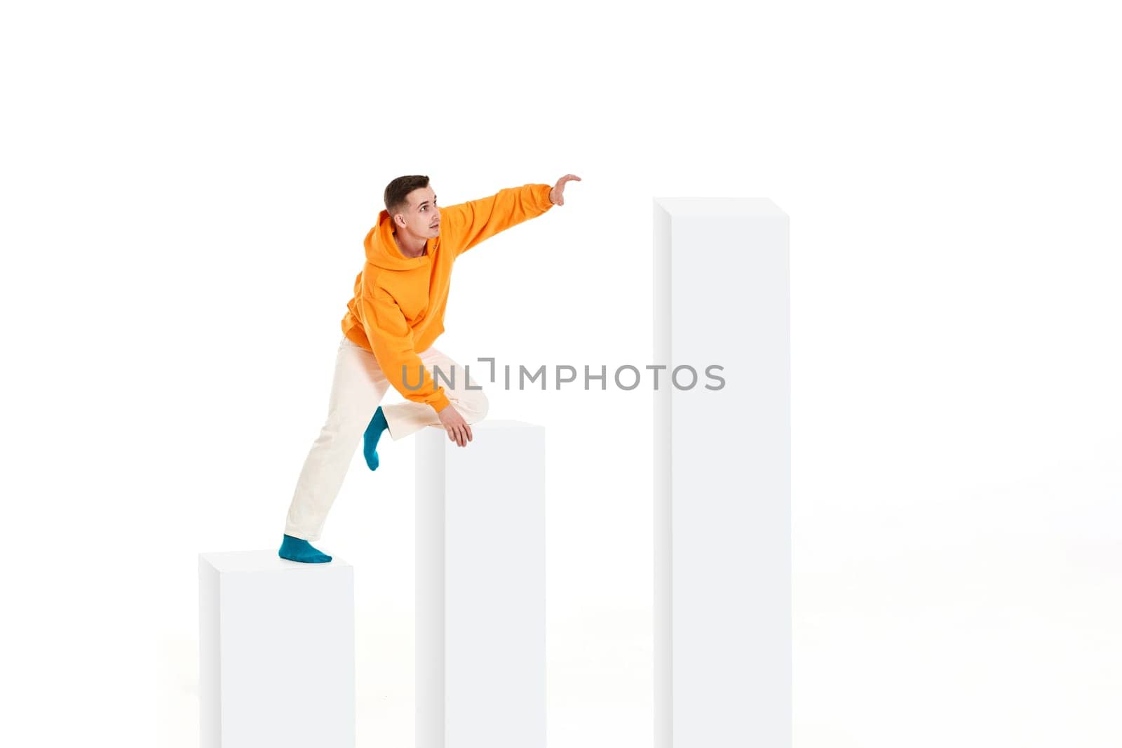 young man going up the bar chart in growth concept.