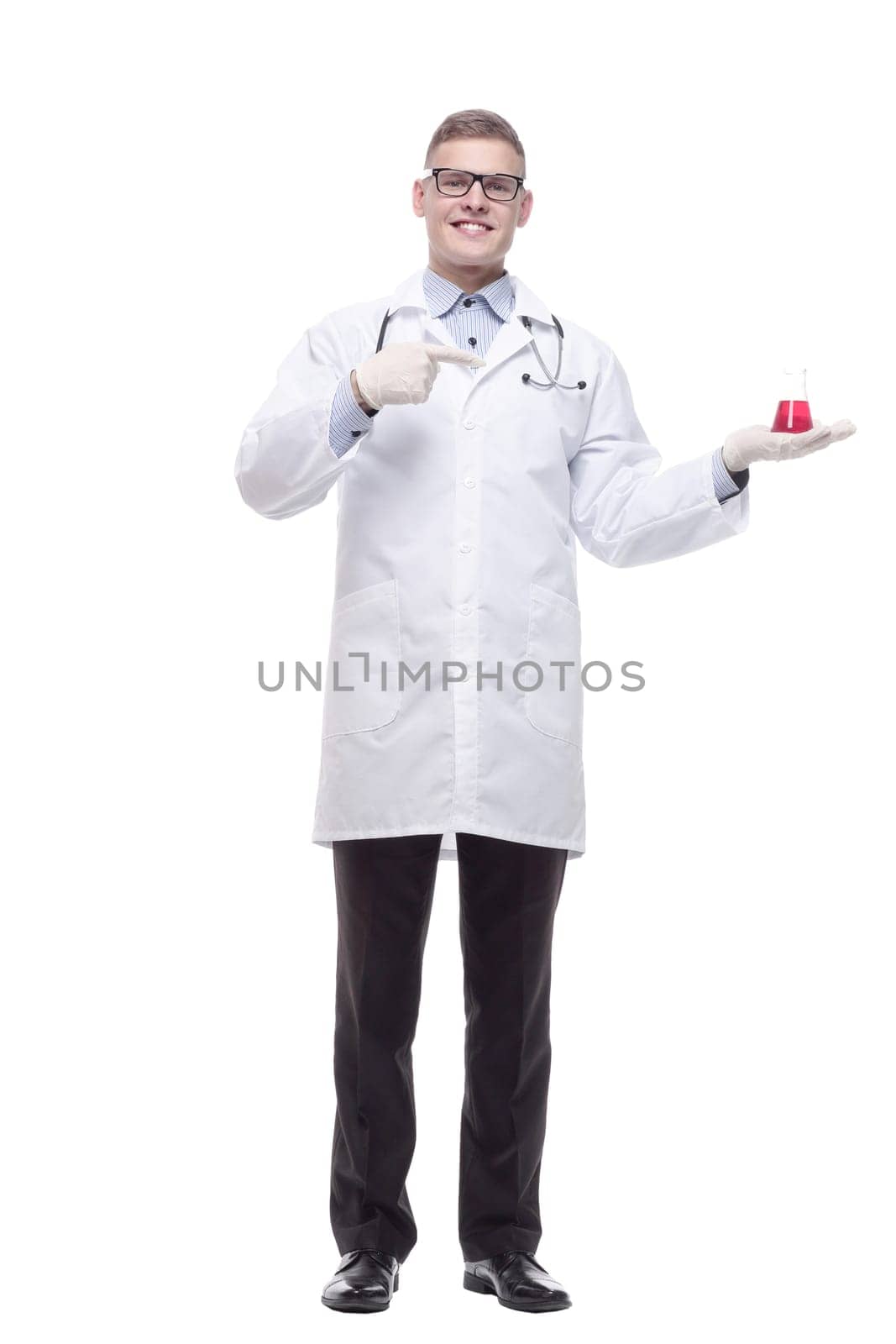 in full growth. smiling doctor with a laboratory flask. isolated on a white background.