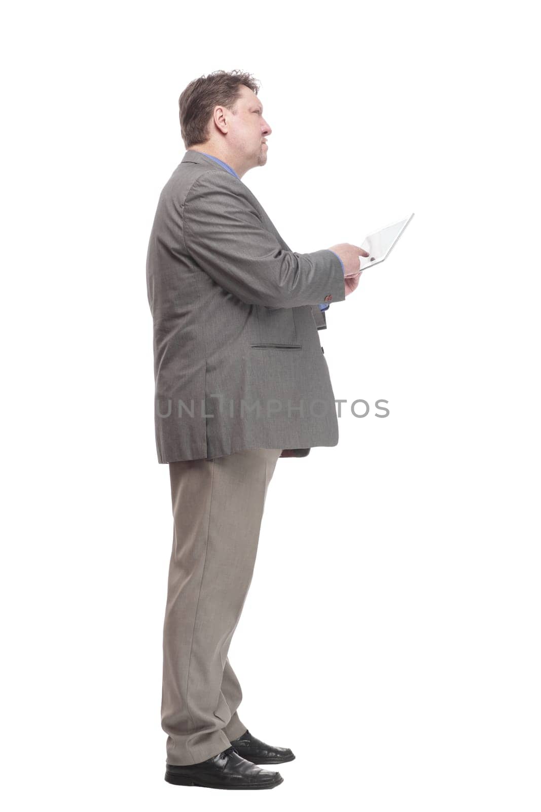in full growth. business man with a digital tablet. isolated on a white background.