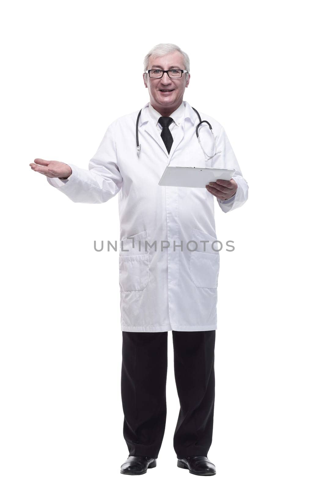 in full growth.qualified mature doctor with digital tablet . isolated on a white background.