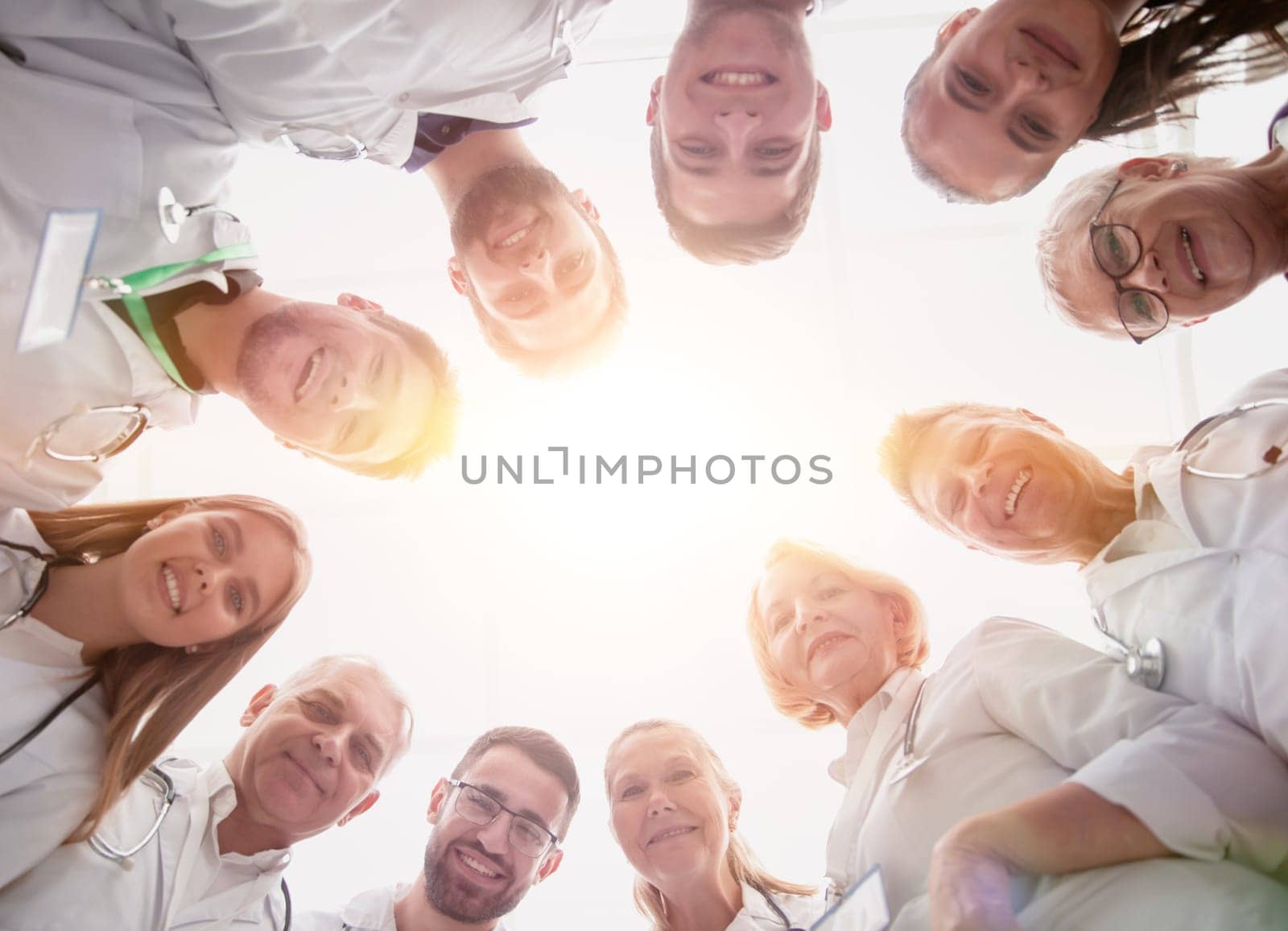 close up. group of doctors standing in a circle and looking at you . photo with a copy-space