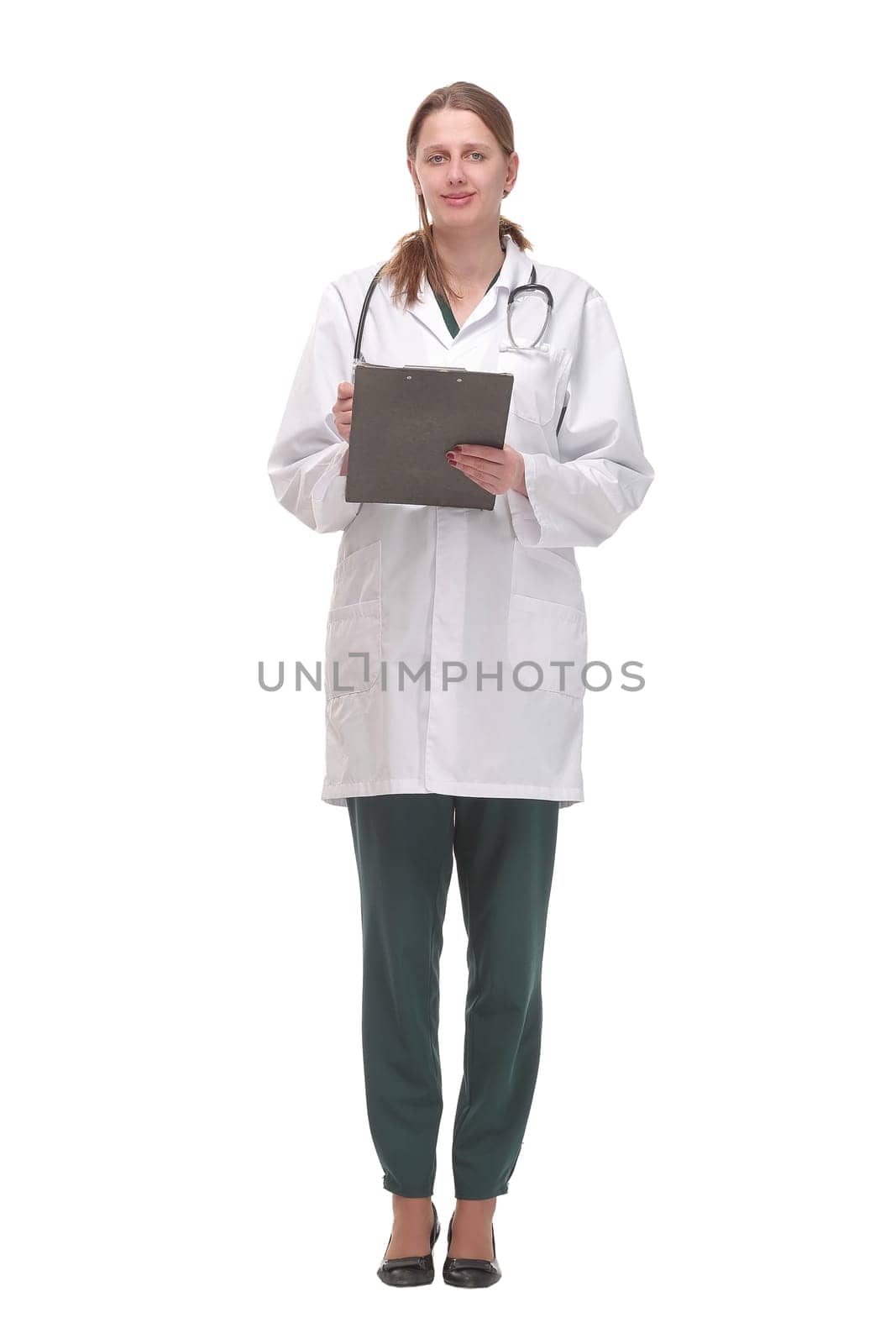 Happy smiling female doctor with stethoscope writing on clipboard, isolated on white background