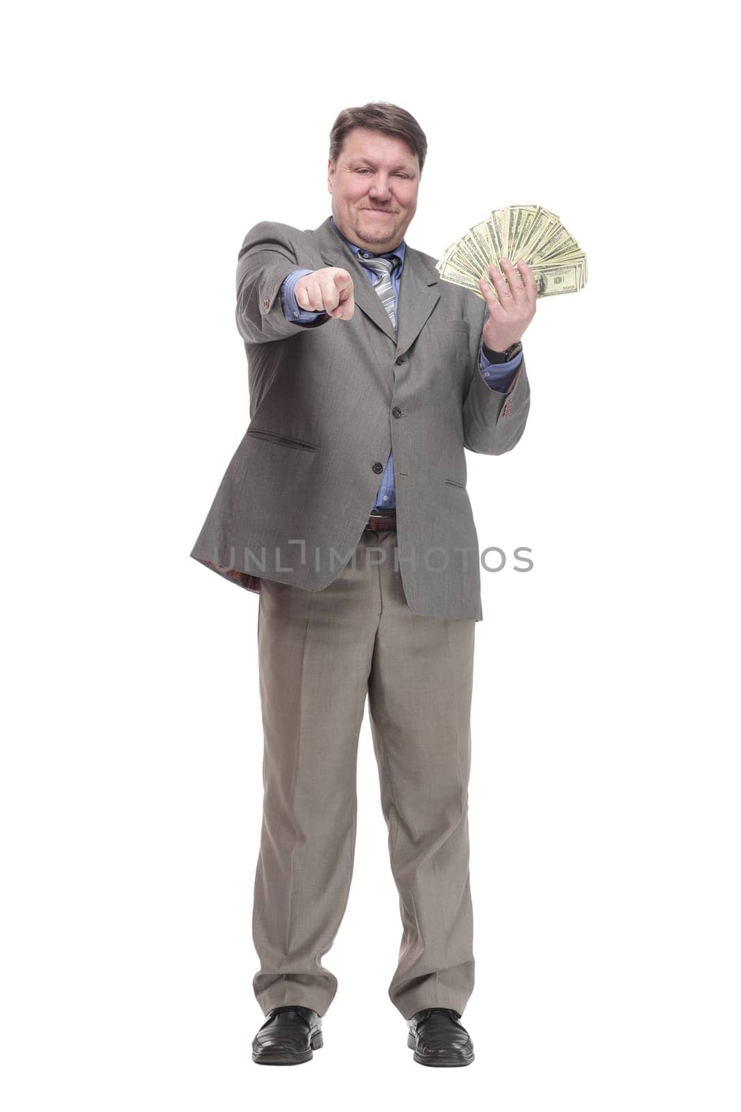 in full growth. happy man with dollar bills. isolated on a white background.
