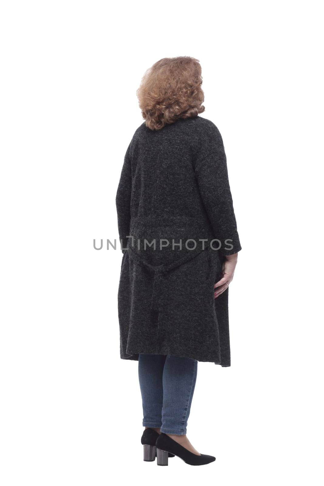 rear view. casual woman looking at a large white screen. isolated on a white background
