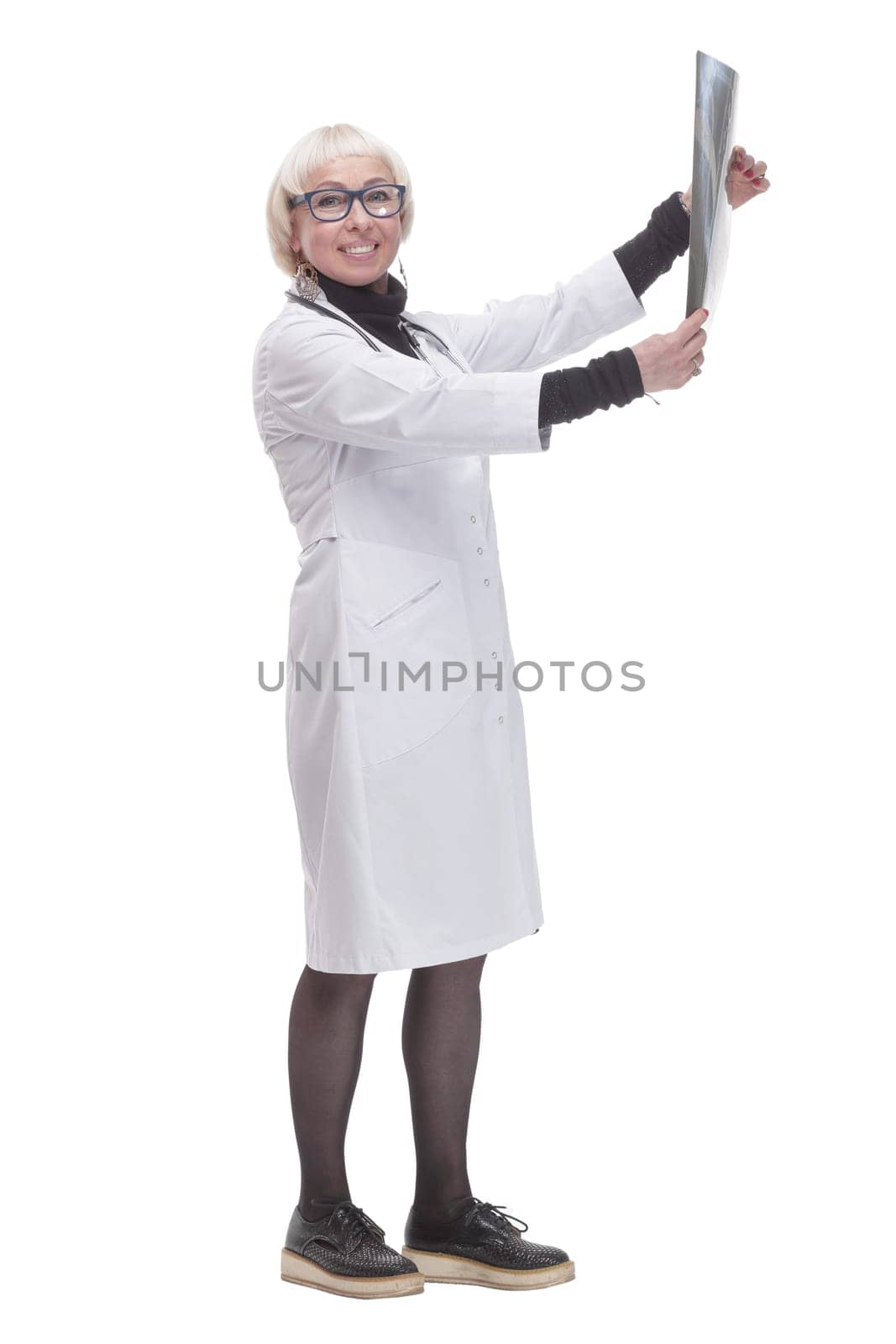 in full growth. female doctor with an x-ray. isolated on a white background.
