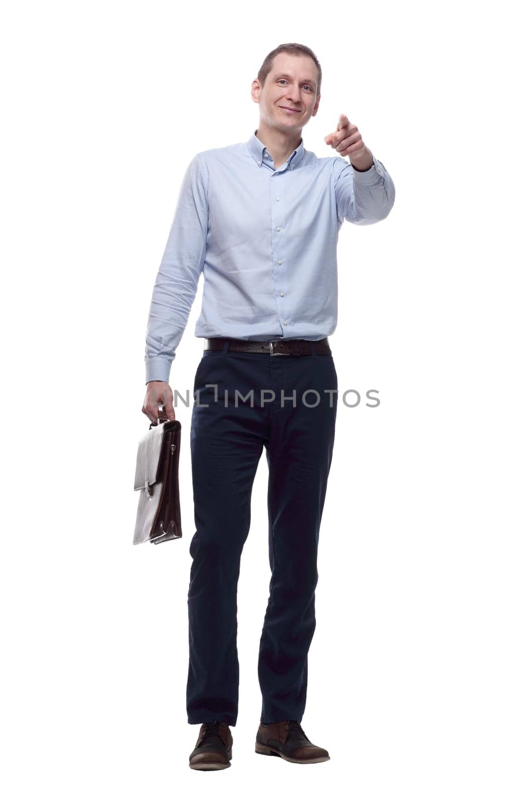 in full growth.a confident young man with a leather briefcase. isolated on a white
