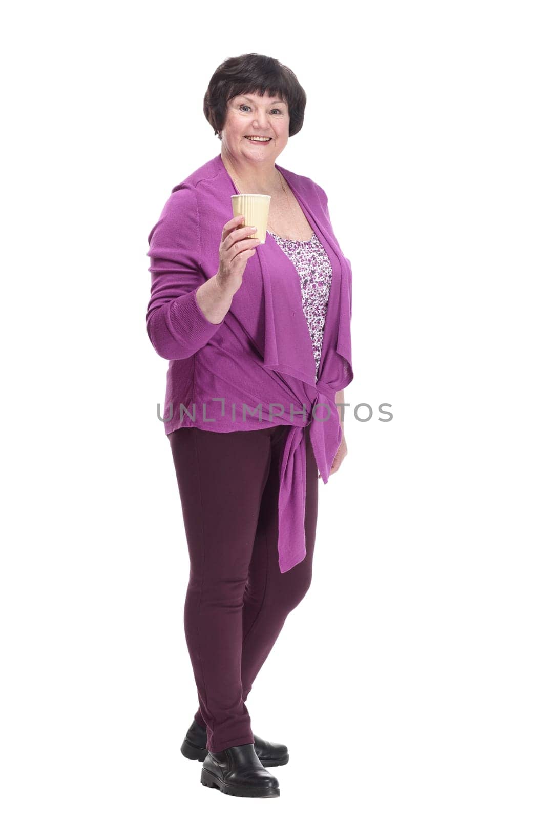 full-length. casual senior woman with takeaway coffee. isolated on a white background