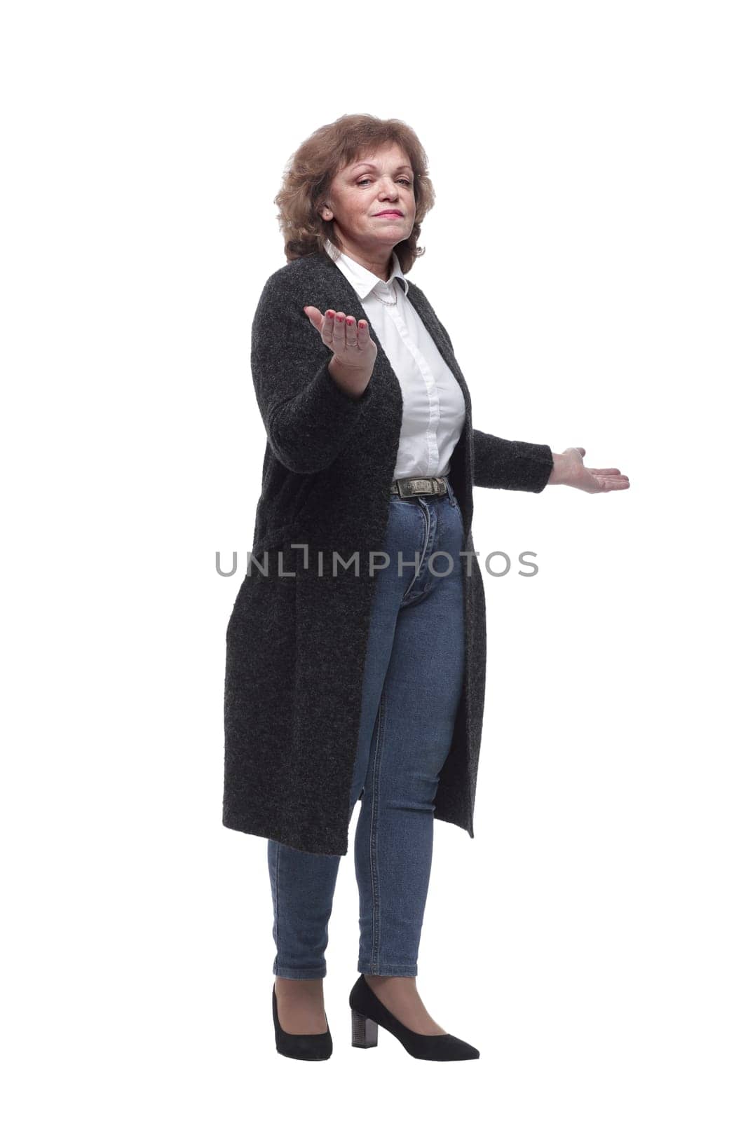 in full growth. modern mature woman looking at you. isolated on a white background