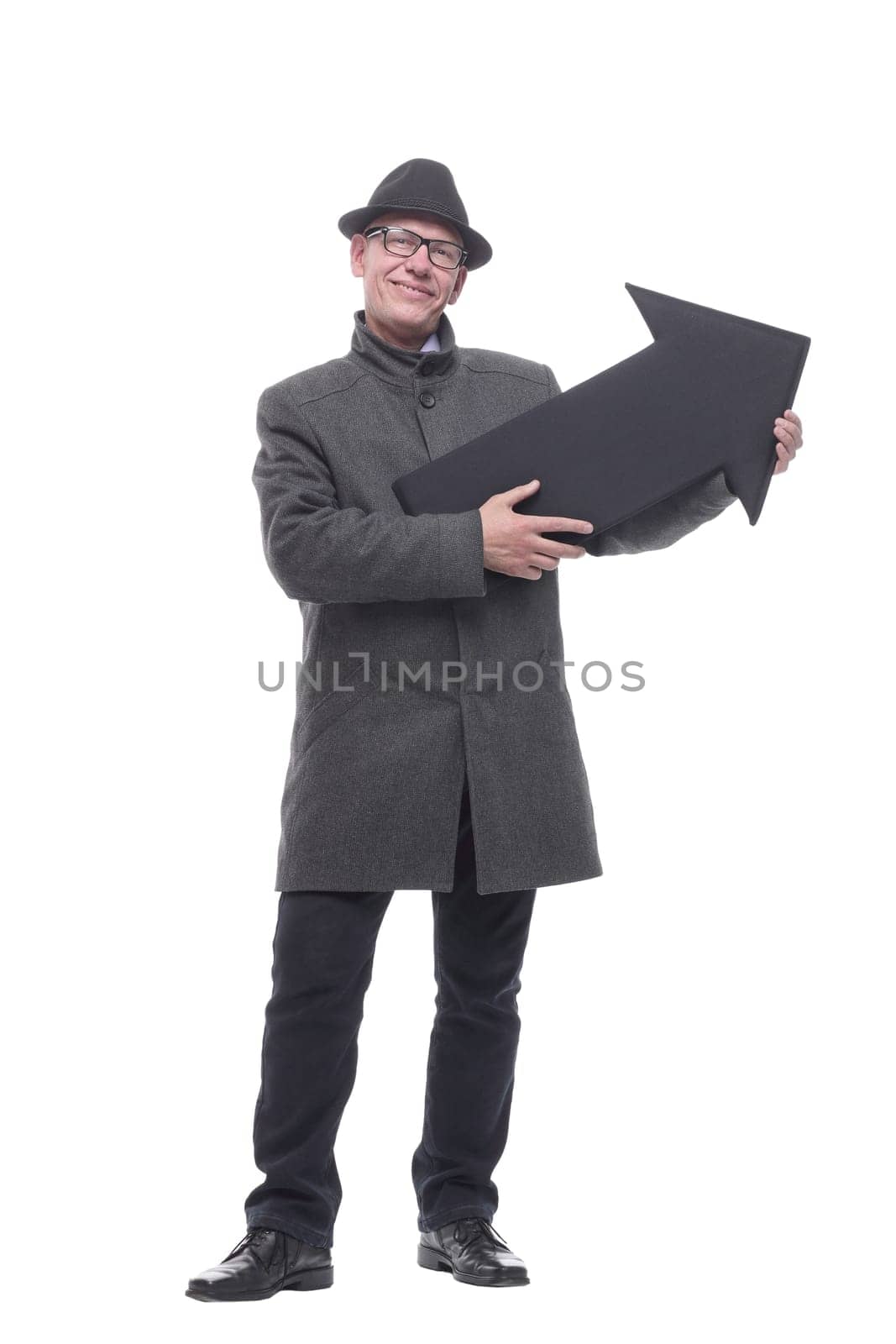 intelligent man in a hat pointing in the direction. isolated on a white background.