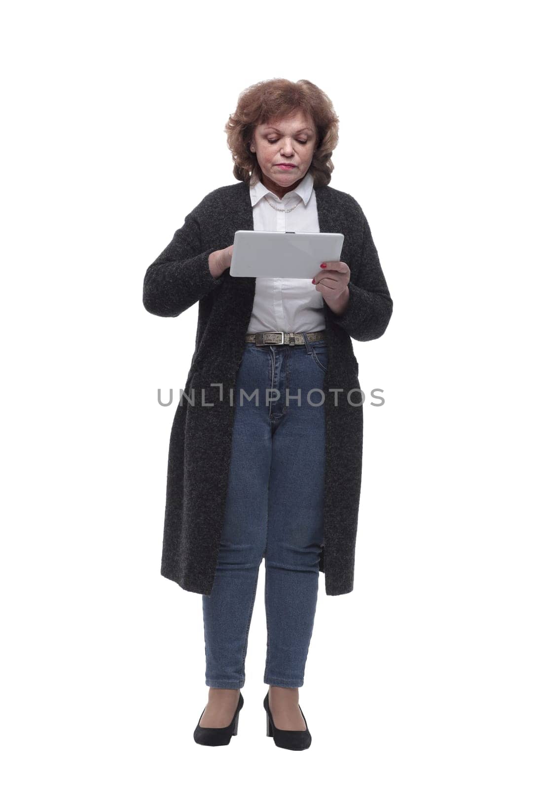 in full growth. mature woman with a digital tablet. isolated on a white background