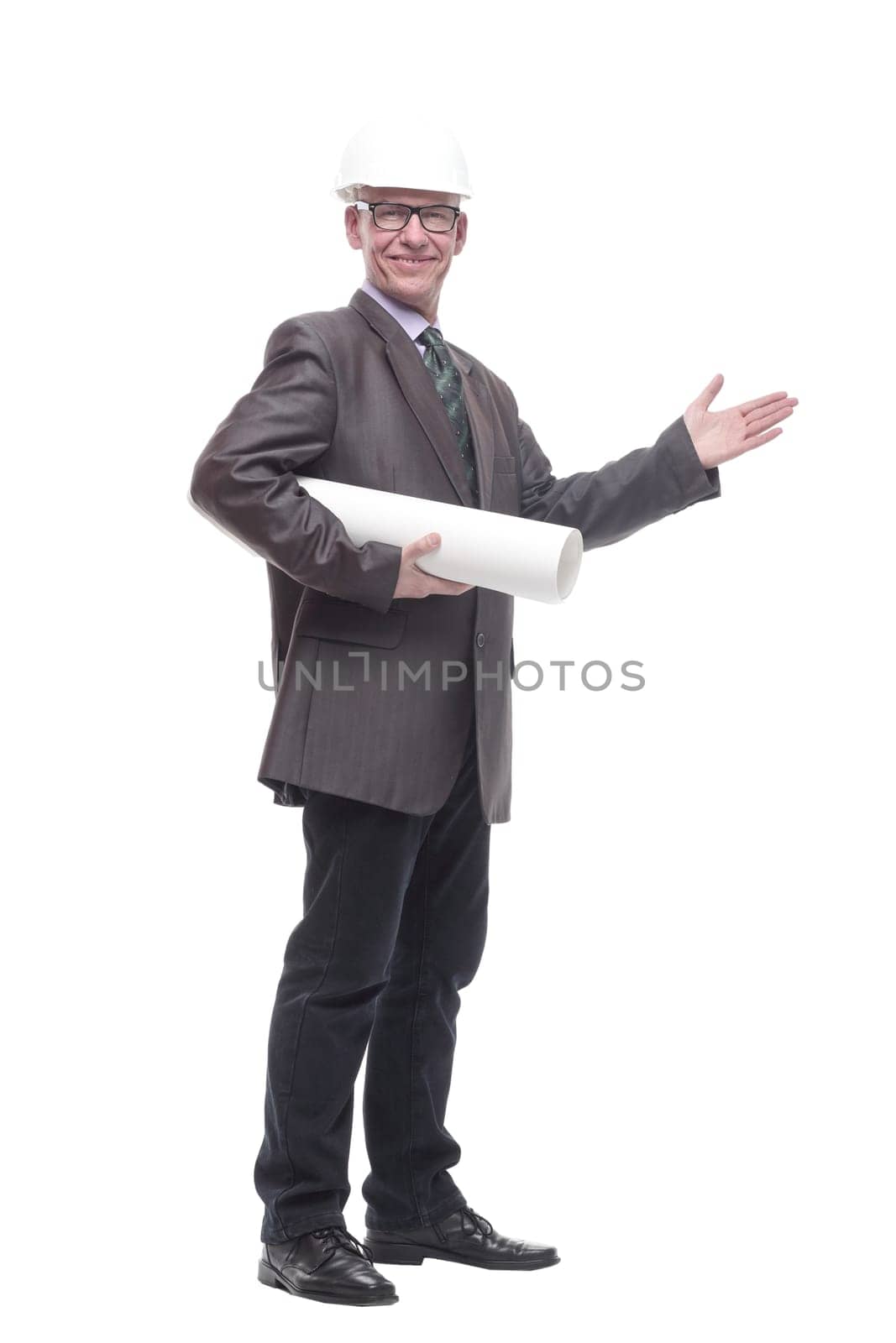 in full growth. business man in a protective helmet with drawings. isolated on a white background.