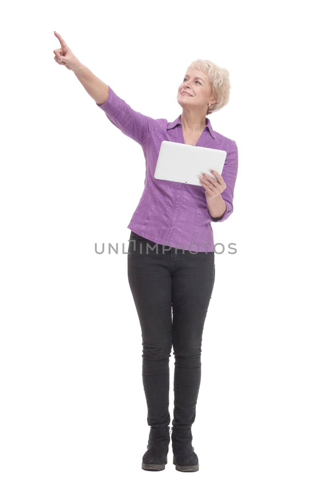 in full growth. smiling mature woman with a digital tablet . isolated on a white background.
