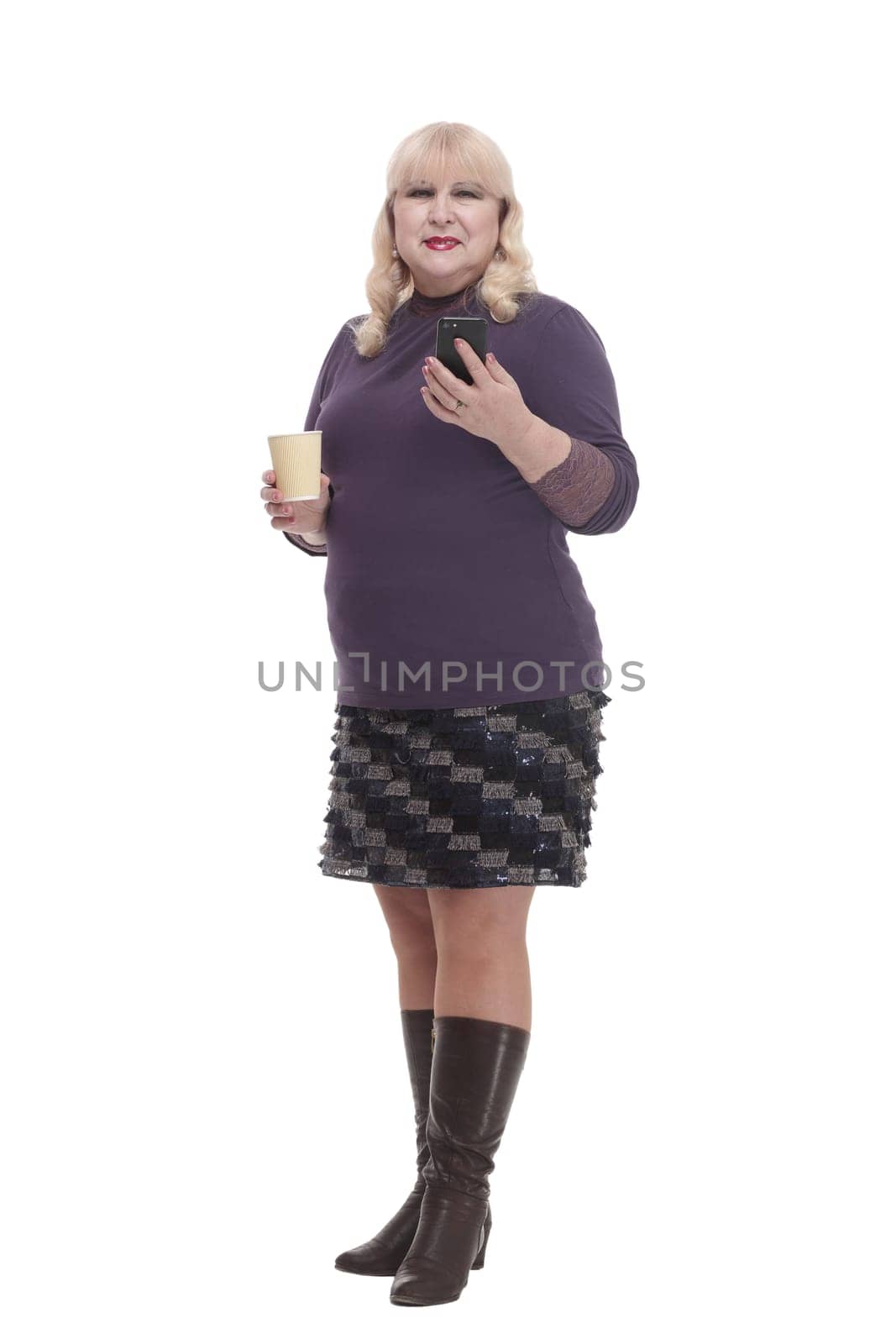 casual mature woman with smartphone and coffee to takeaway . isolated on a white background.