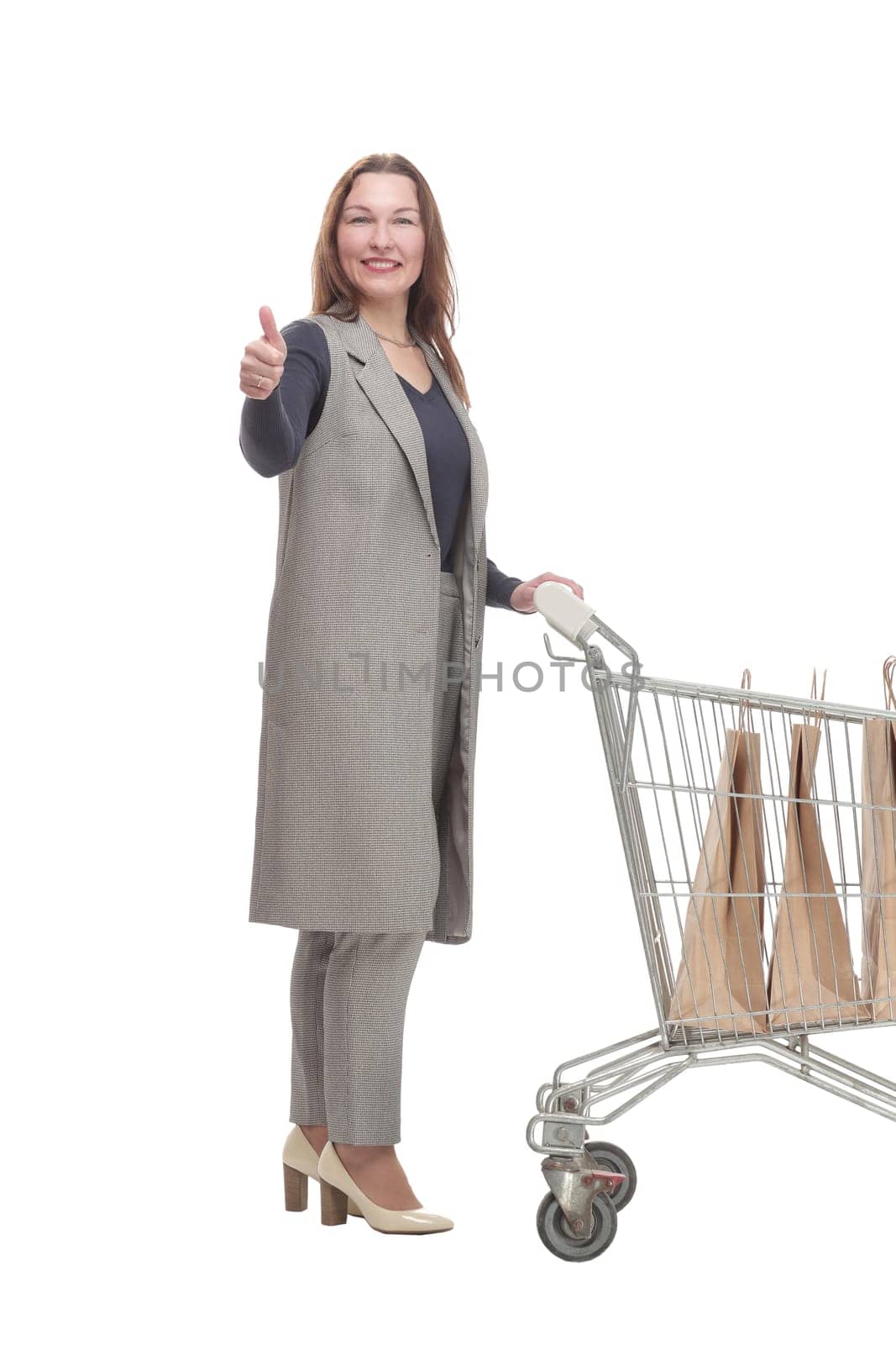 in full growth. elegant woman with a shopping cart.isolated on a white background.