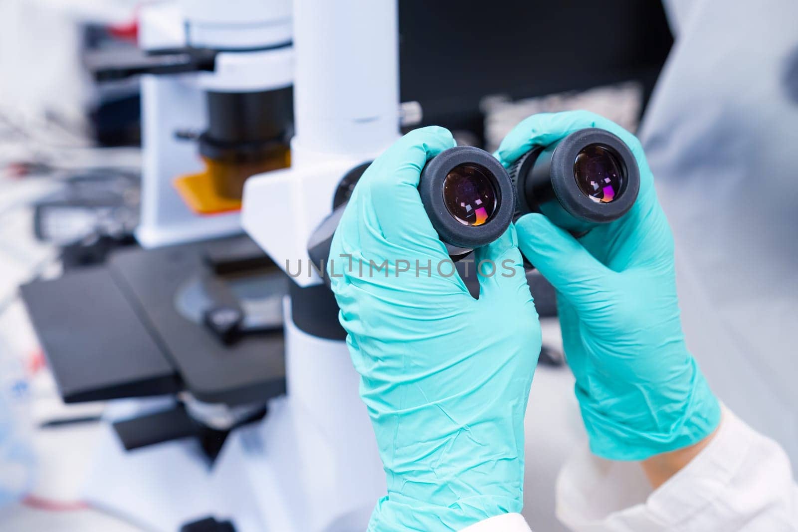 Close up of binoculars of microscope focused on a specimen.